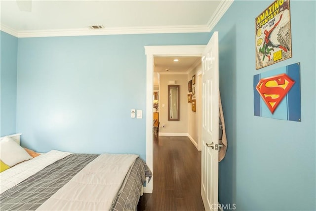 bedroom featuring dark hardwood / wood-style flooring and ornamental molding