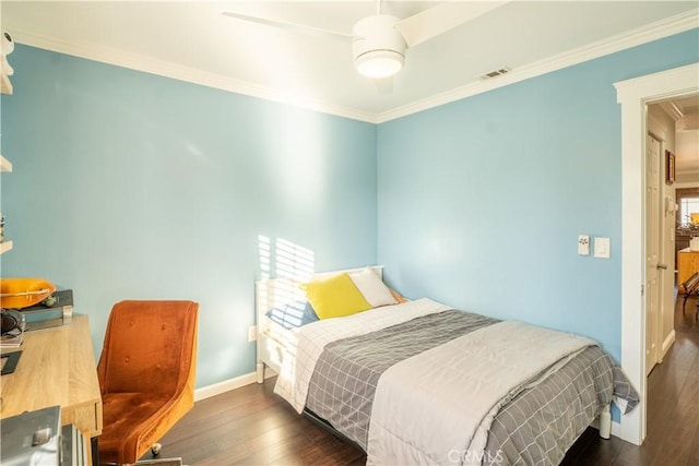 bedroom with ceiling fan, dark wood-type flooring, and ornamental molding