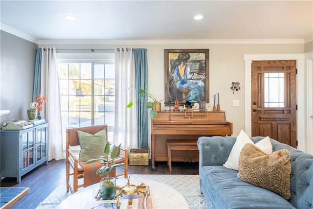 sitting room featuring hardwood / wood-style floors and crown molding