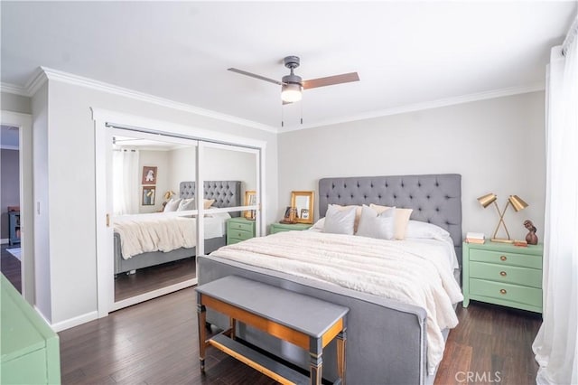 bedroom with a closet, dark hardwood / wood-style flooring, crown molding, and ceiling fan