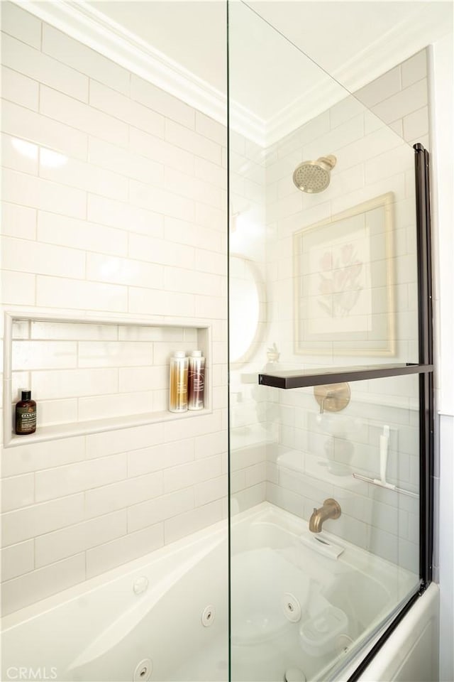 bathroom with shower / bath combination with glass door and ornamental molding