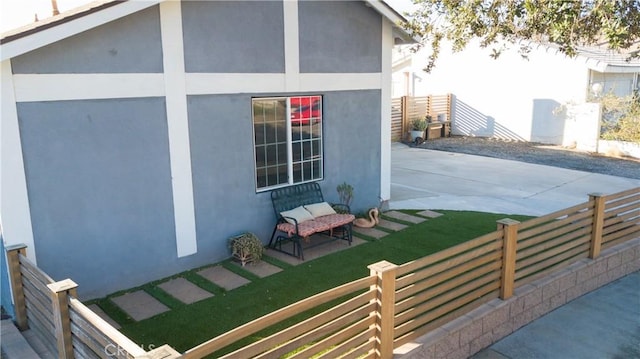 view of side of property with a patio area