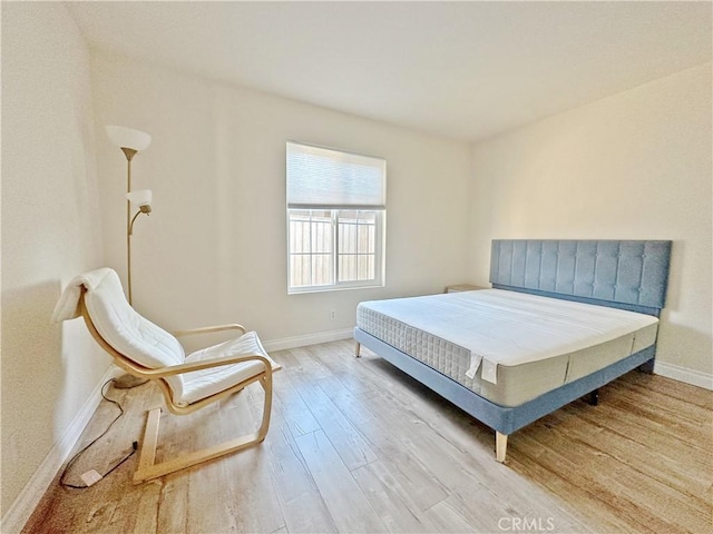 bedroom with light hardwood / wood-style flooring