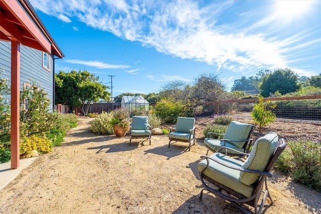 view of patio featuring an outbuilding