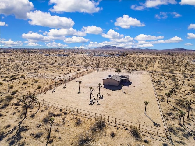 birds eye view of property with a mountain view and a rural view