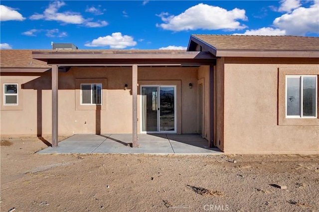 back of property with a patio area