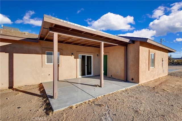 back of house with a patio area