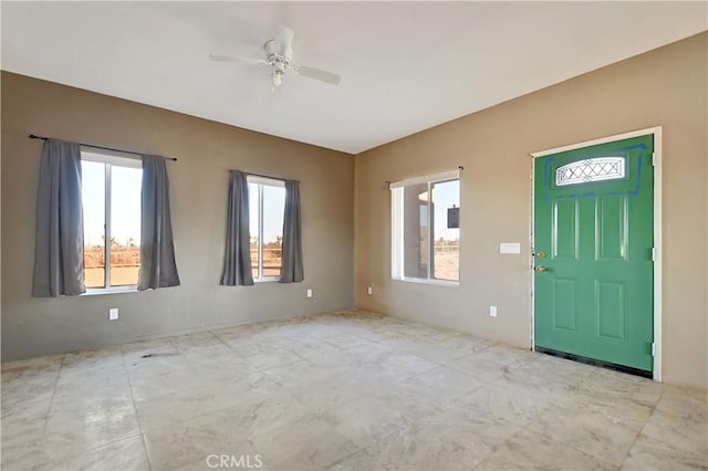 entryway featuring ceiling fan