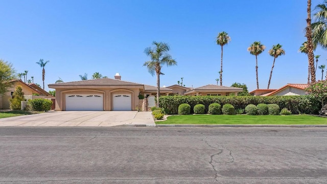 ranch-style house with a garage and a front lawn