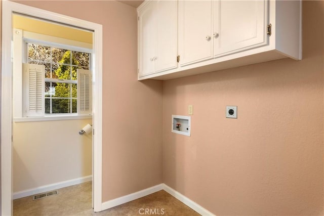 laundry room featuring cabinets, washer hookup, and hookup for an electric dryer