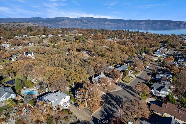 bird's eye view with a water and mountain view