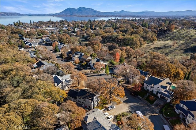 aerial view featuring a water and mountain view