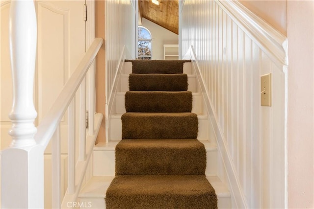 staircase with lofted ceiling