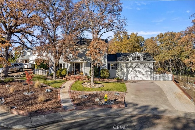 view of front of house with a garage and a front lawn