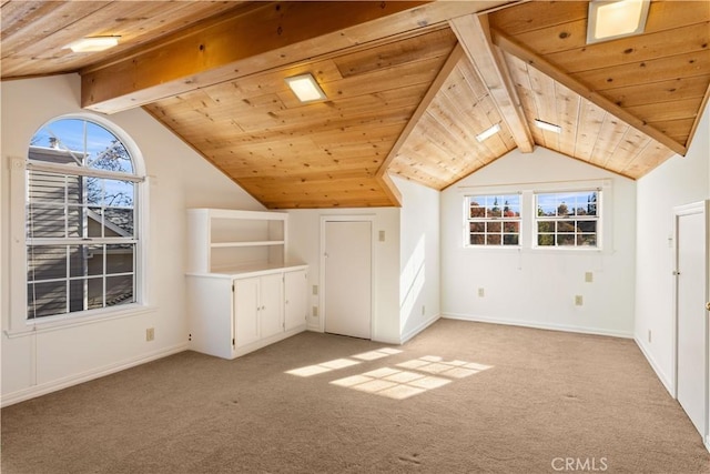 bonus room with wooden ceiling, plenty of natural light, and light colored carpet