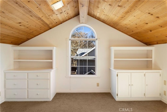 additional living space with lofted ceiling with beams, wood ceiling, and light carpet