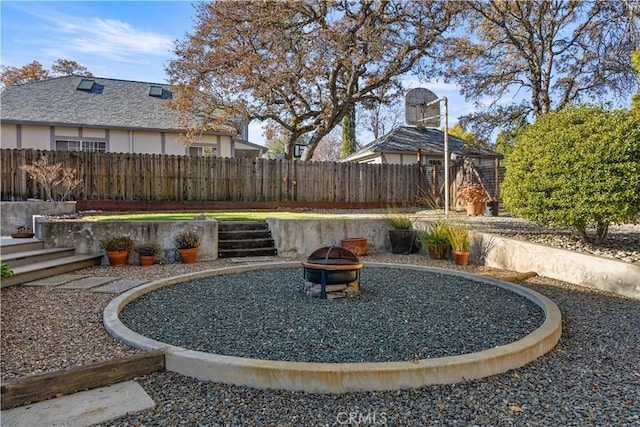 view of yard with an outdoor fire pit