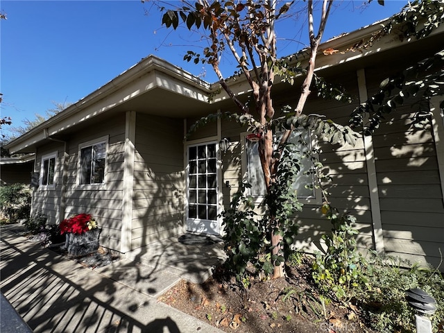 view of property exterior with a patio