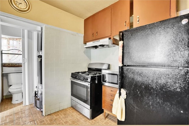 kitchen featuring decorative backsplash and appliances with stainless steel finishes