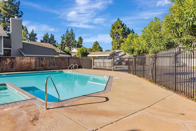 view of swimming pool featuring a patio