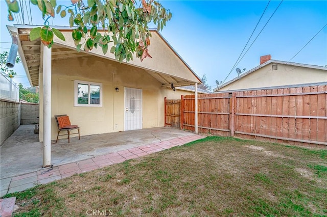 rear view of property featuring a patio area