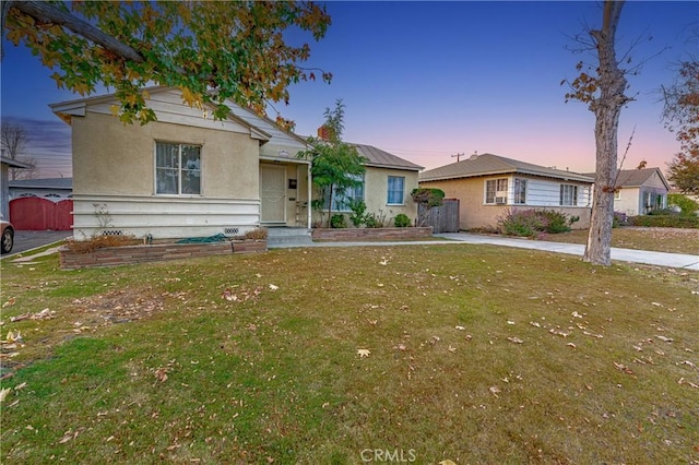 ranch-style house with a yard