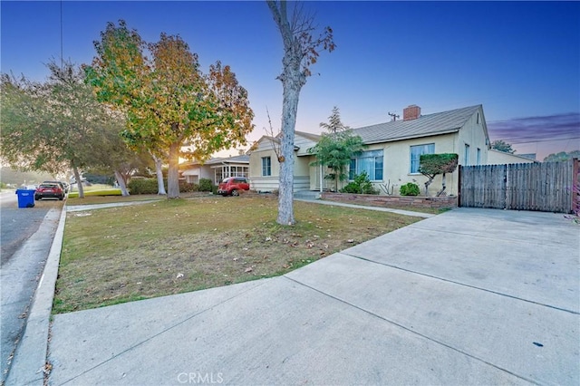 view of front of home with a yard