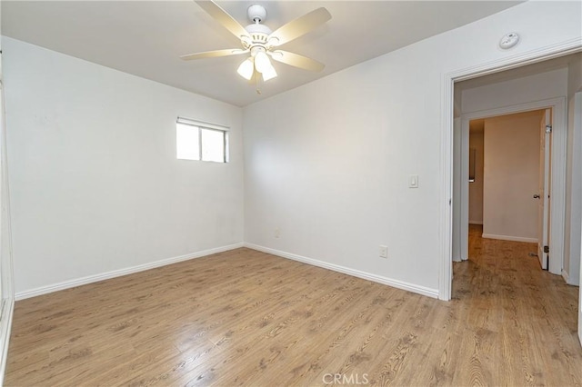 spare room with ceiling fan and light hardwood / wood-style floors