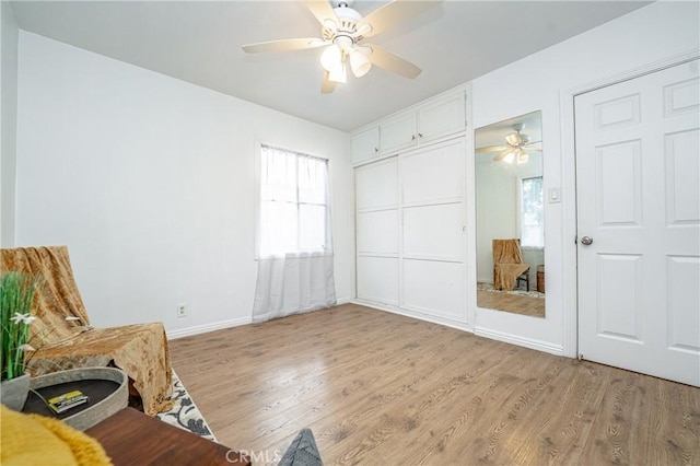 unfurnished room featuring light hardwood / wood-style flooring and ceiling fan