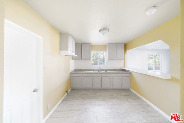 kitchen with gray cabinets and sink