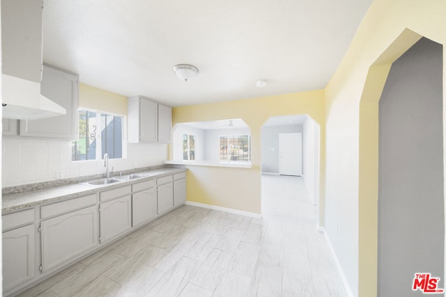 kitchen with decorative backsplash and sink