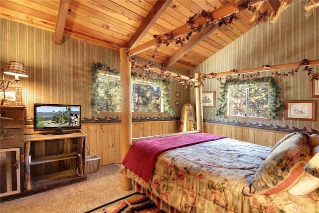 carpeted bedroom featuring lofted ceiling with beams, wood ceiling, and multiple windows