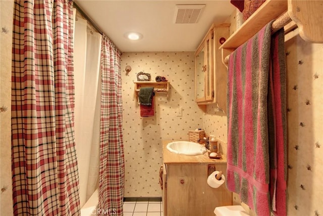 bathroom with tile patterned floors, vanity, and shower / bathtub combination with curtain