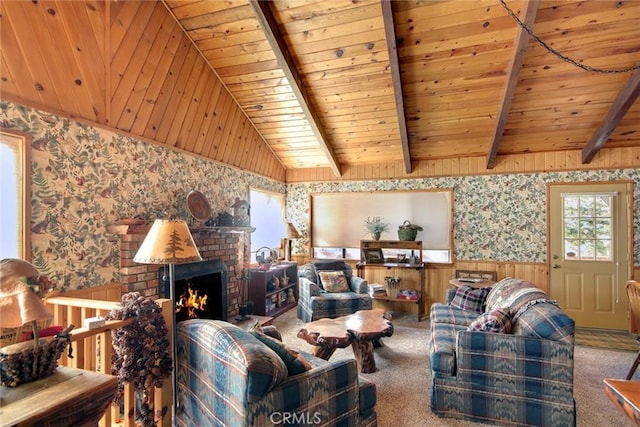 carpeted living room with vaulted ceiling with beams, wood ceiling, a fireplace, and wooden walls