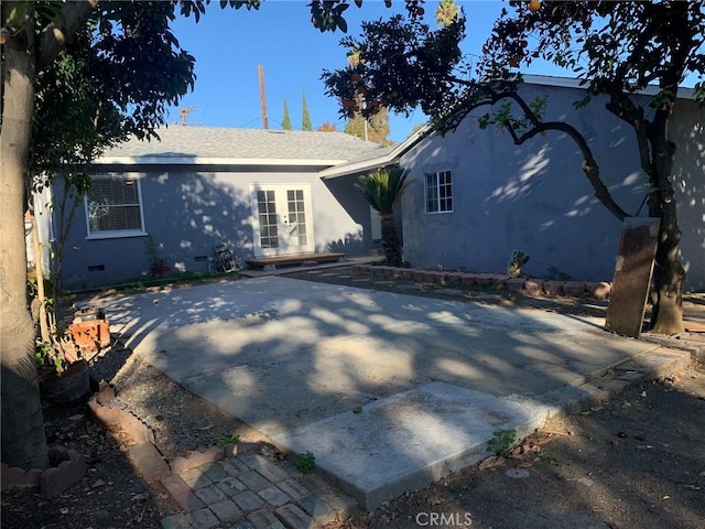 back of house with french doors and a patio