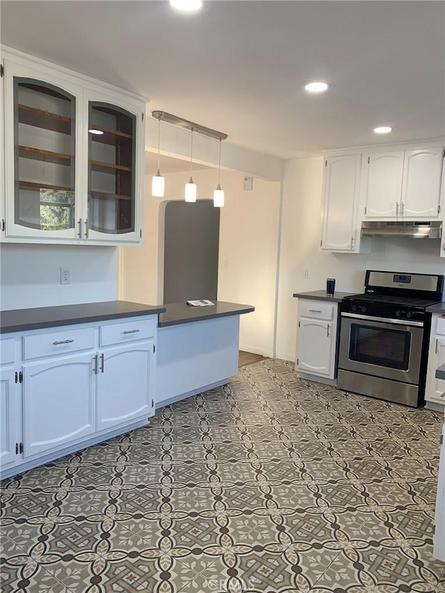 kitchen with white cabinets, decorative light fixtures, stainless steel stove, and kitchen peninsula