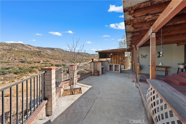 view of patio featuring a mountain view