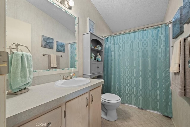 bathroom featuring toilet, a textured ceiling, and vanity