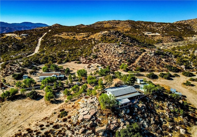 birds eye view of property featuring a mountain view