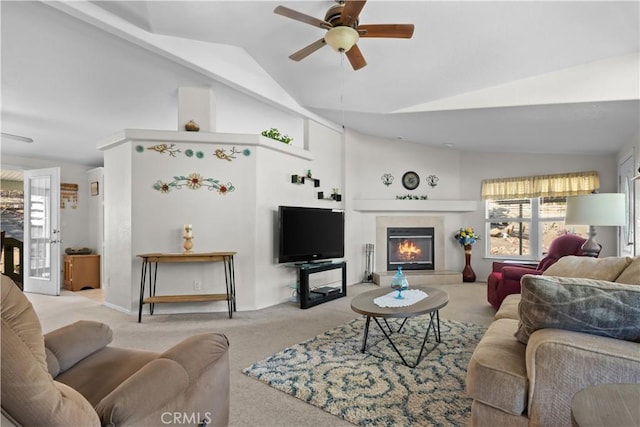 carpeted living room featuring lofted ceiling and ceiling fan