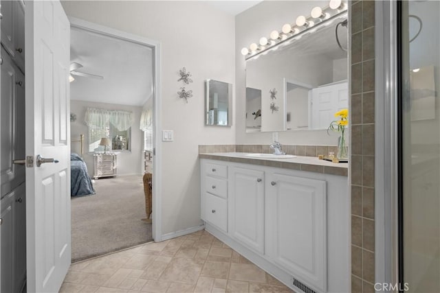 bathroom featuring ceiling fan and vanity