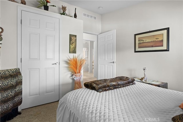 bedroom featuring a closet and light carpet