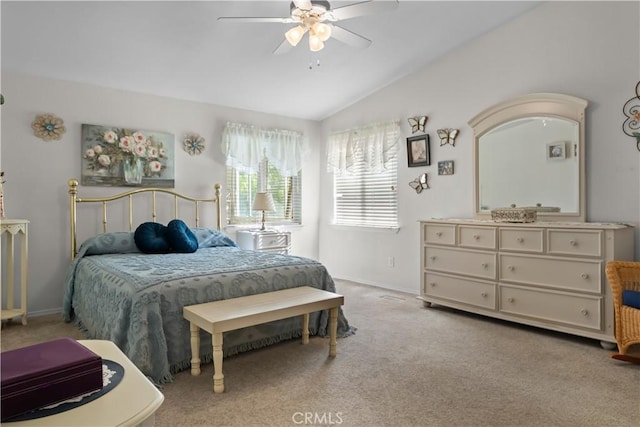 bedroom with ceiling fan, light colored carpet, and lofted ceiling