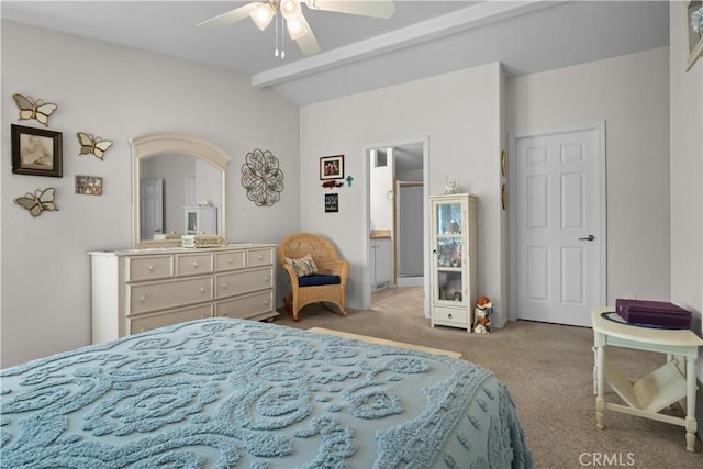 carpeted bedroom featuring ceiling fan and beamed ceiling