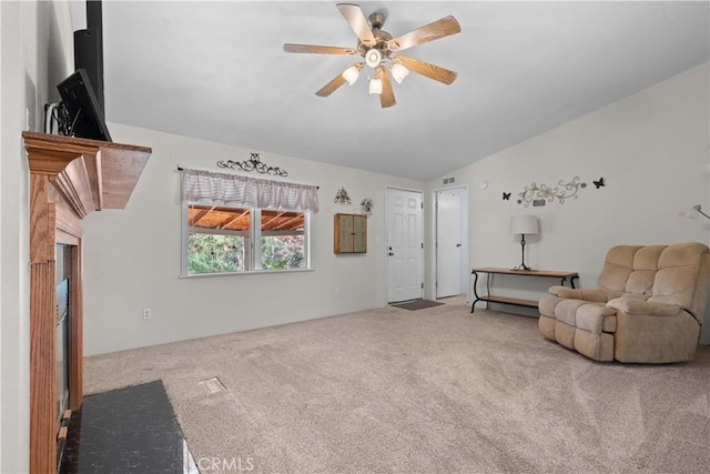 unfurnished living room with ceiling fan, lofted ceiling, and carpet floors