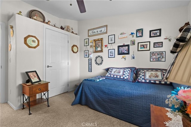 carpeted bedroom with ceiling fan