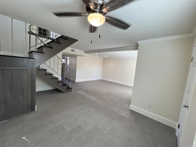 basement with ceiling fan, crown molding, and tile patterned flooring