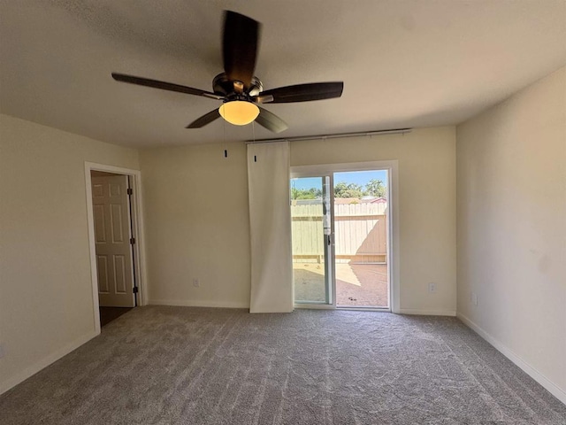 empty room featuring ceiling fan and carpet floors