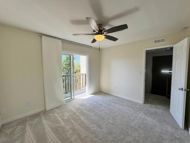 carpeted empty room with ceiling fan