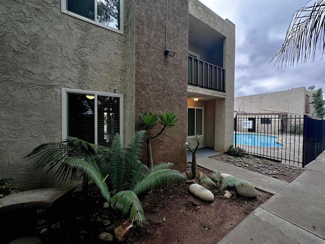 exterior space featuring a fenced in pool